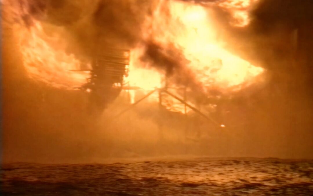 Piper Alpha disaster footage 6th July 1988, close up of rig structure on fire