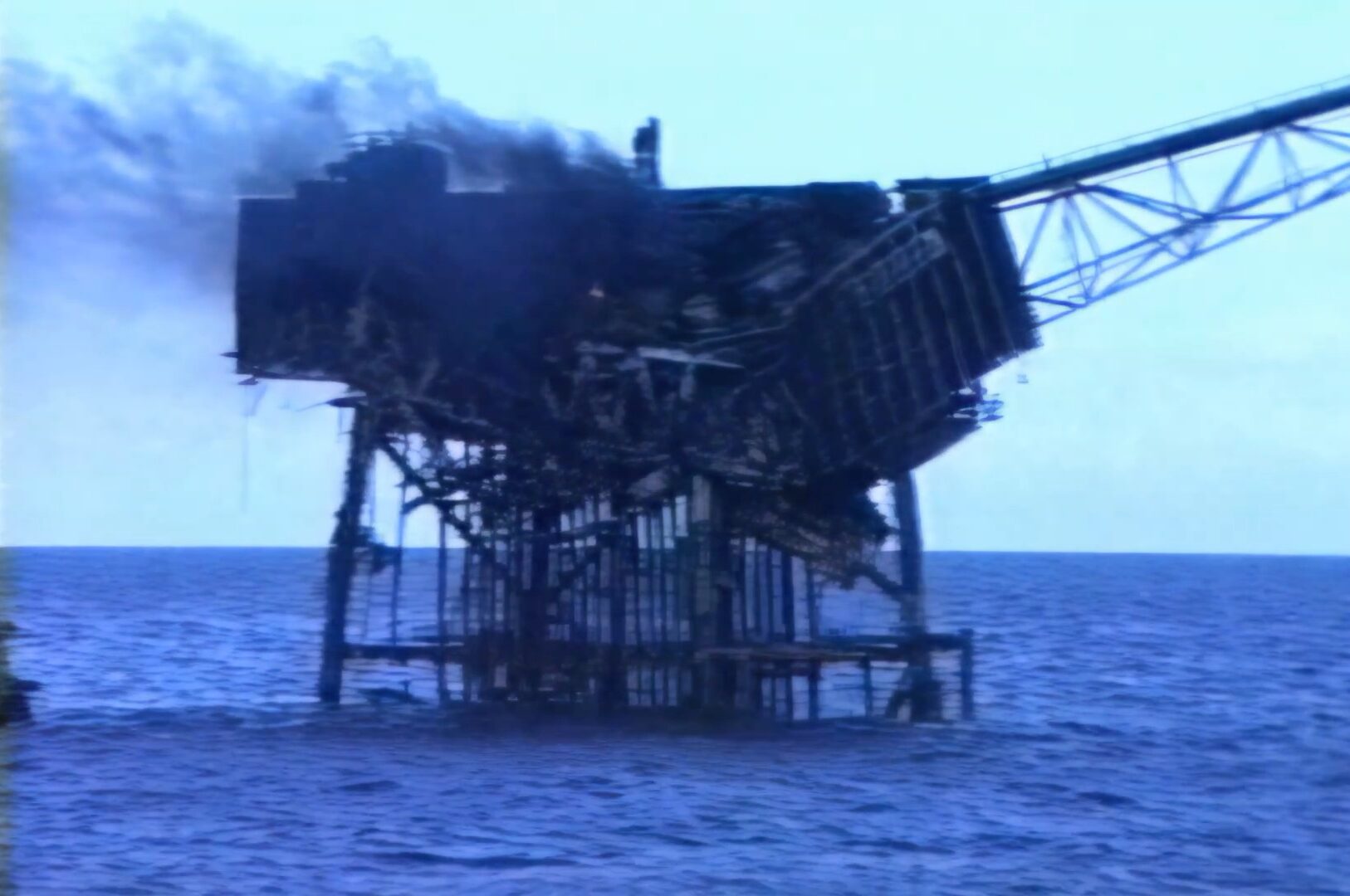 Piper Alpha disaster footage 6th July 1988 the smouldering remains of the rig the next morning